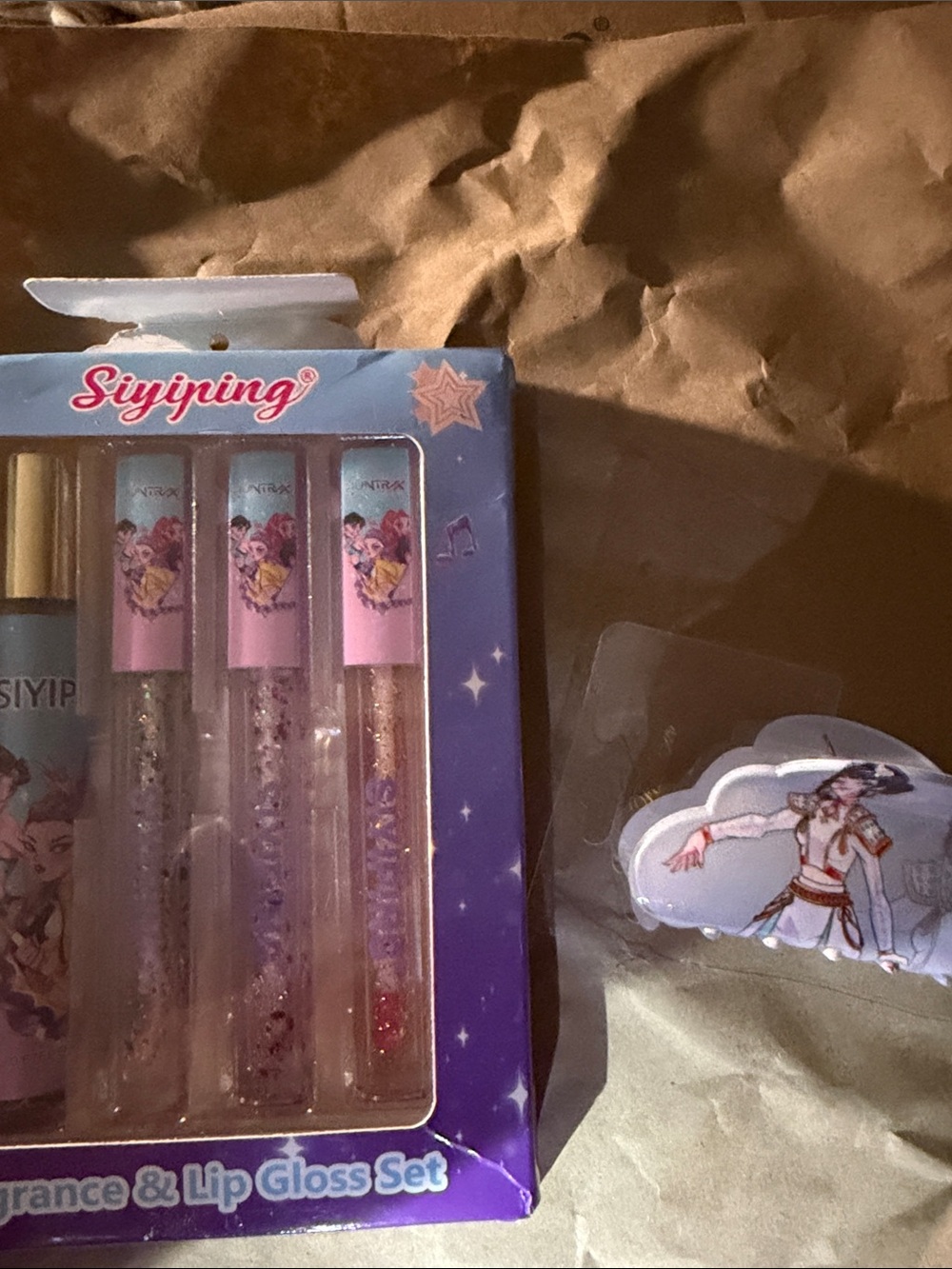 Fragrance and lip gloss set and hair claw